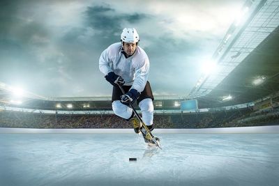 Hockey player with stick and puck